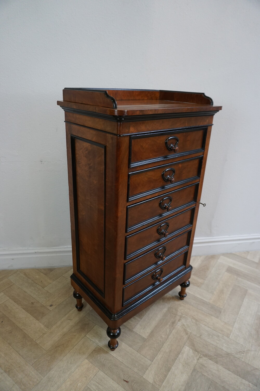 Walnut wellington chest of drawers